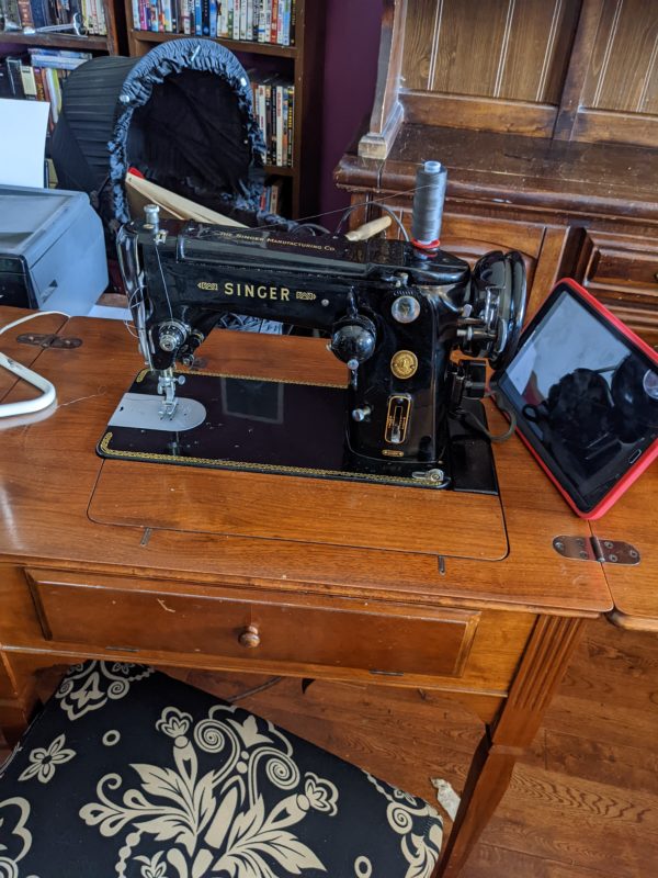 old singer sewing machine built into a table