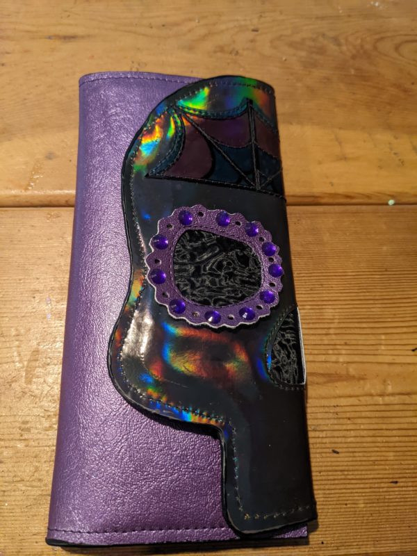 half skull face wallet in purple day of the dead theme